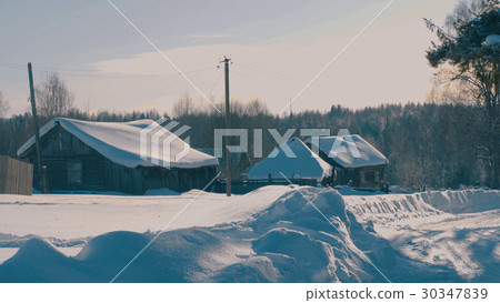 Winter village in a forest. Winter village in a forest. 30347839