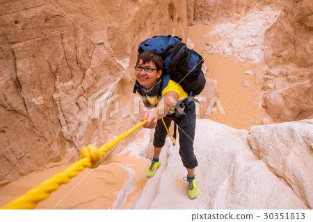Woman climbing in canyon, Sinai, Egypt 30351813