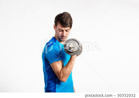 Fitness man holding dumbbell, working out, studio Fitness man holding dumbbell, working out, studio 30352032
