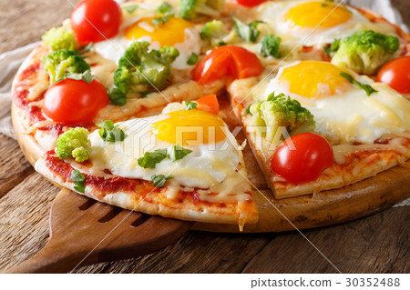 Sliced pizza with eggs, broccoli, tomatoes Sliced pizza with eggs, broccoli, tomatoes 30352488