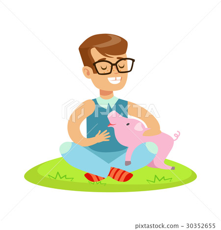 Smiling little boy sitting on green grass and 30352655