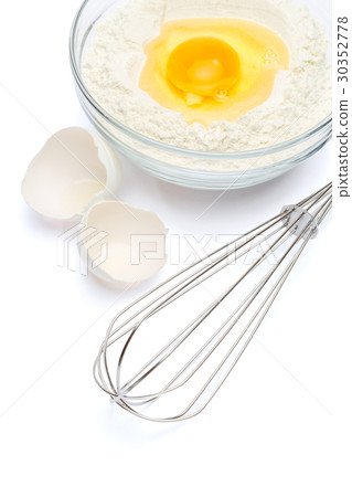 Flour with egg in glass bowl 30352778
