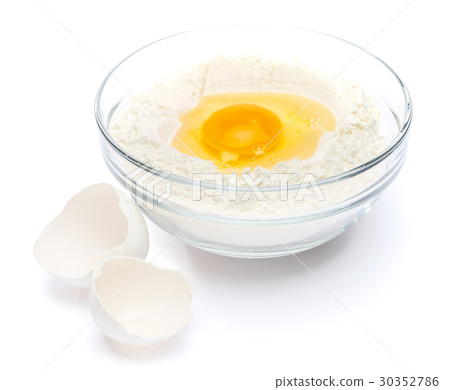 Flour with egg in glass bowl Flour with egg in glass bowl 30352786