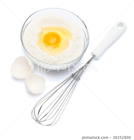 Flour with egg in glass bowl Flour with egg in glass bowl 30352800