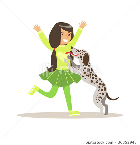 Smiling girl playing with her dalmatian dog Smiling girl playing with her dalmatian dog 30352943