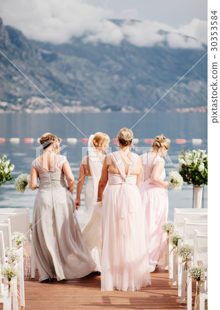 bride with bridesmaids at wedding in mountains 30353584