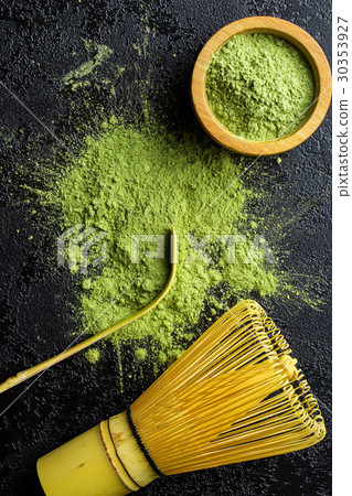 Green matcha tea powder with bamboo whisk . 30353927