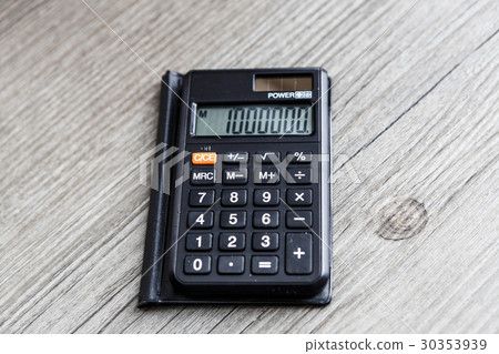 black calculator on wooden floor 30353939