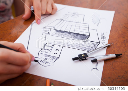 Closeup of drawing building at the desk 30354303