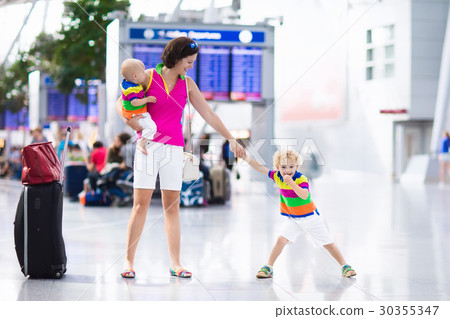 Family at airport before flight Family at airport before flight 30355347
