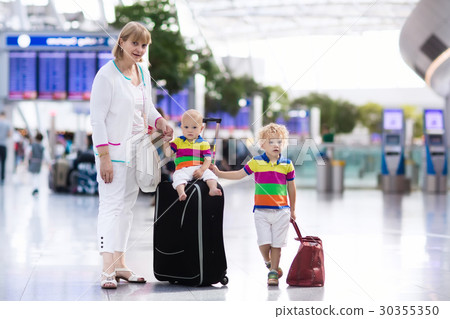 Family at airport before flight Family at airport before flight 30355350