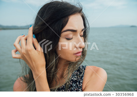 gloomy stylish hipster girl straightens the 30356968