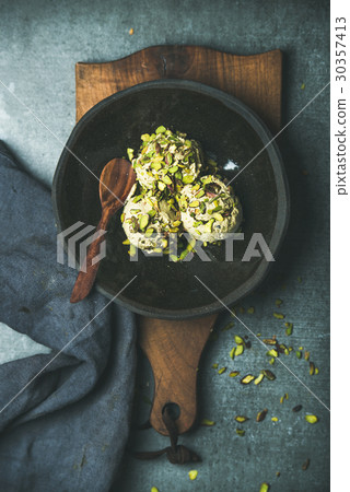 Homemade pistachio ice cream with crashed nuts in Homemade pistachio ice cream with crashed nuts in 30357413
