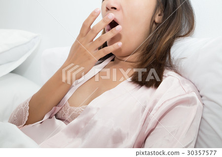 Yawning tired woman on white background Yawning tired woman on white background 30357577