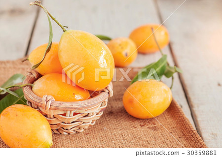 yellow fruit on wooden. yellow fruit on wooden. 30359881