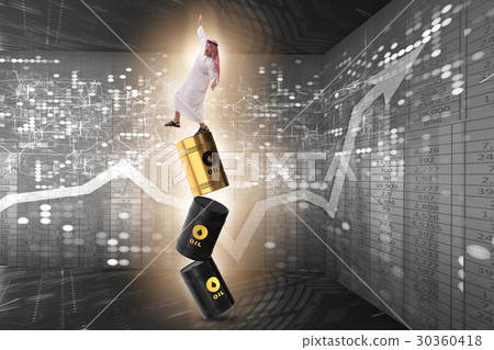 Arab businessman losing balance on oil barrels 30360418