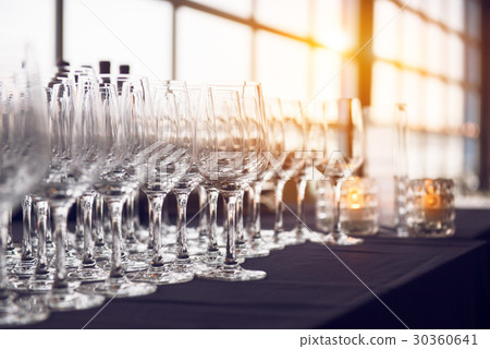 Empty wine glasses in the row in the bar  30360641