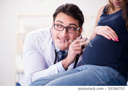 Doctor examining pregnant woman patient Doctor examining pregnant woman patient 30366701