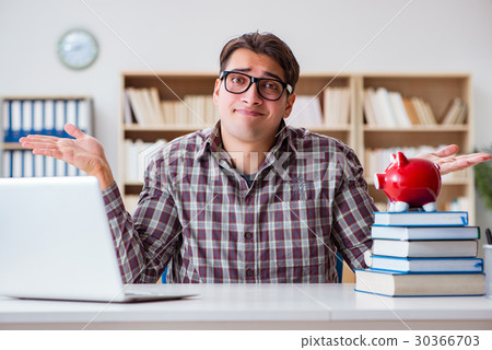 Student breaking piggybank to pay for tuition fees Student breaking piggybank to pay for tuition fees 30366703