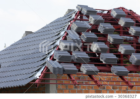 black tile roof on residential building black tile roof on residential building 30368327