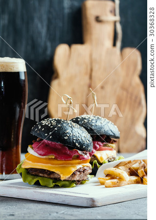 Homemade burger with black bun Homemade burger with black bun 30368328