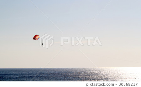 Parasailing over the sea. Parasailing over the sea. 30369217