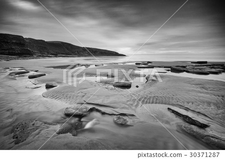 Cloudy Dunraven Bay 30371287