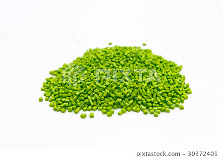 Green plastic pellets on a white background. Green plastic pellets on a white background. 30372401