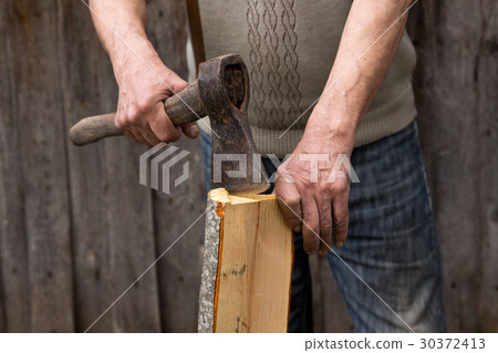 Worker, an elderly man with an old axe Worker, an elderly man with an old axe 30372413