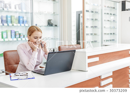Happy smiling female office employee Happy smiling female office employee 30373209