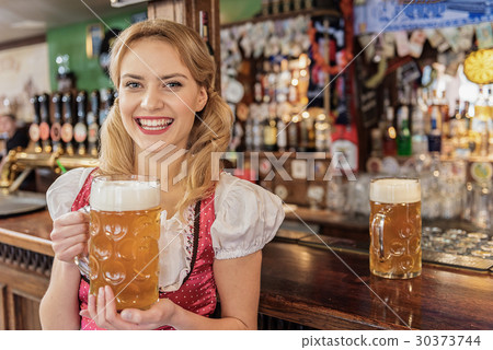 Happy woman working in dramshop 30373744