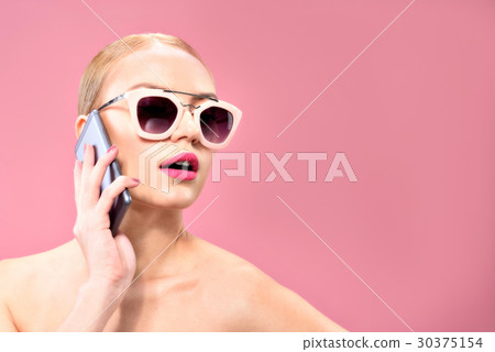 Young cute model using mobile phone 30375154