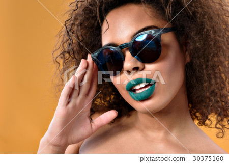 Trendy ethnic female looking at camera Trendy ethnic female looking at camera 30375160