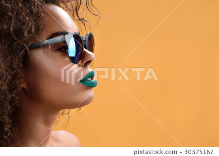 Attractive african girl with green lipstick 30375162