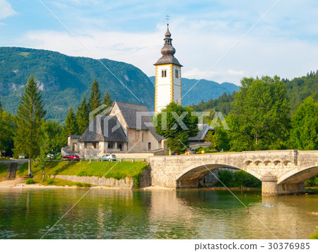 Church of St John the Baptist and old stone bridge 30376985
