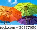 Colorful big umbrellas in the sky.  30377050