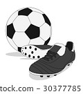 Black and white soccer ball with stud shoes 30377785