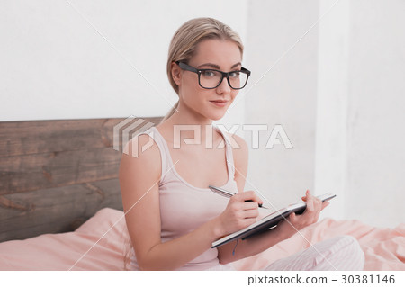 Young Woman Taking Notes Concept 30381146