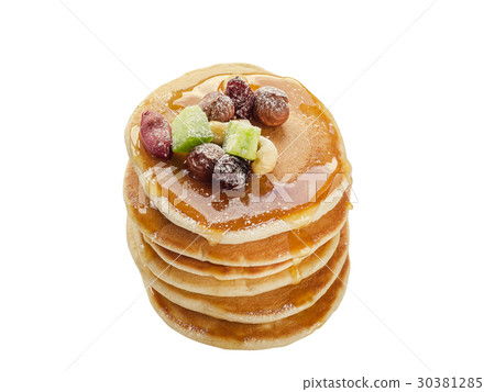 Isolated stack of hot pancakes with nuts Isolated stack of hot pancakes with nuts 30381285