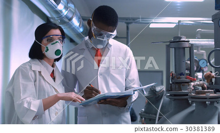 Two scientists with the notepad 30381389