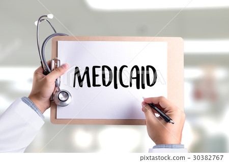 Medical insurance and Medicaid and stethoscope. 30382767
