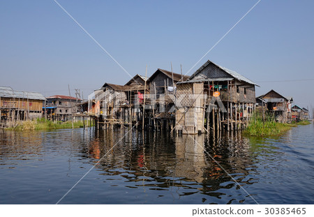 Traditional wooden houses at the Inle Lake 30385465