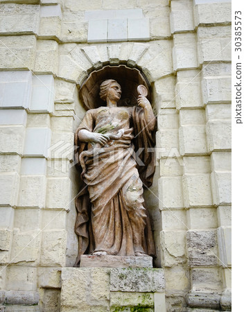 God statue on the stone wall at ancient castle God statue on the stone wall at ancient castle 30385573