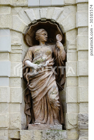 God statue on the stone wall at ancient castle God statue on the stone wall at ancient castle 30385574