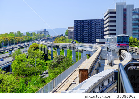 Monorail running in the fresh green suburbs 30386962