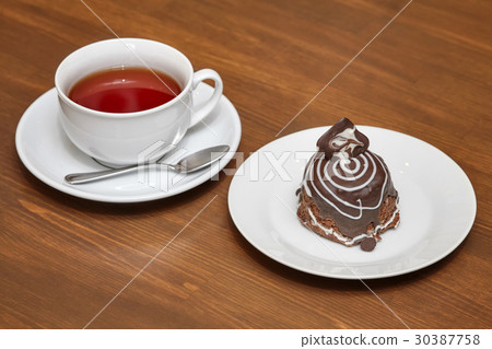 Chocolate pastry covered with glaze 30387758