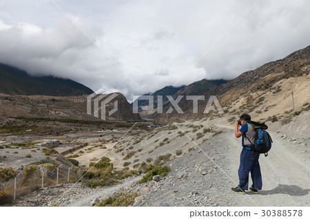 Backpacker trekking in Annapurna circuit, Nepal. Backpacker trekking in Annapurna circuit, Nepal. 30388578