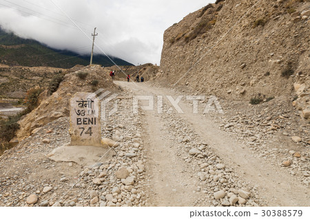 Milestone near the road in annapurna area, Nepal. 30388579