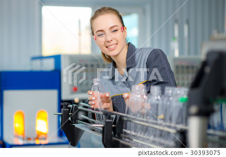 Worker at a water factory 30393075