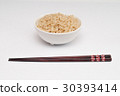 Brown rice and chopsticks cooked 30393414